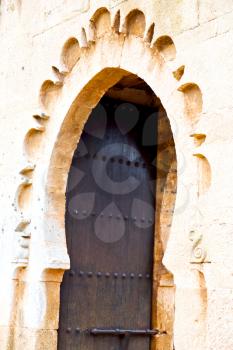 olddoor in morocco  africa ancien and wall ornate brown green