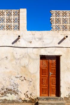   oman old wooden  door and wall in the house