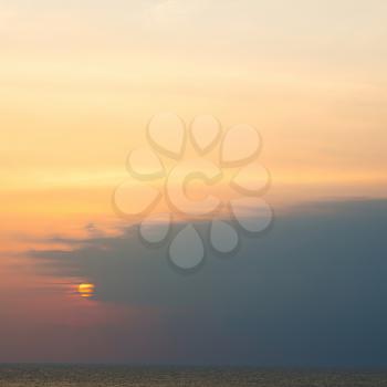  the blurred  sun falling down arabian sea ocean  in oman coastline