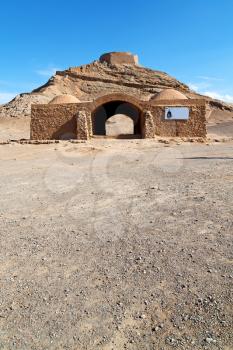 blur in iran near yazd the antique zoroastrian temple abandonated house and contruction