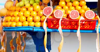 in a open market fresh fruit like orange and lemon like healty food