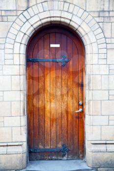 wooden parliament in london old church door and marble antique  wall