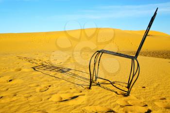 table and seat in  desert sahara morocco    africa yellow sand