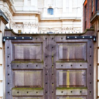 wooden parliament in london old   door and marble antique  wall