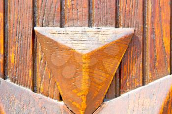 abstract texture of a brown antique wooden   old door in italy   europe