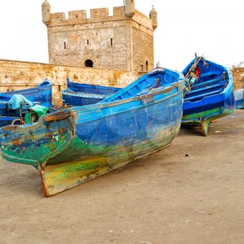   boat and sea in africa morocco old castle brown brick  sky
