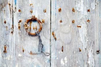 brown  morocco in africa the old wood  facade home and rusty safe padlock 