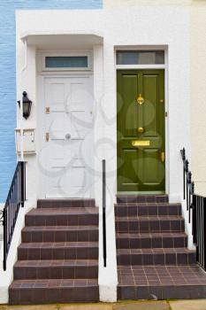 notting hill in london england old suburban and antique blue  wall door 