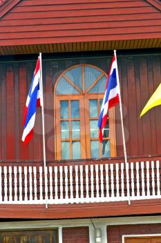 temple   in  bangkok thailand incision red venetian blind and terrace waving flag 