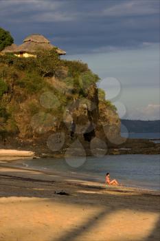 tourist stone house cabin hill in a brown beach in nosy be  madagascar