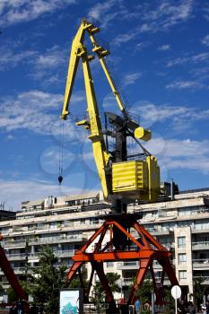 house sky clouds and red yellow crane in  buenos aires argentina