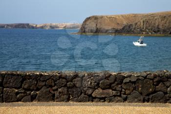 coast lanzarote  in spain musk pond beach  water yacht boat  and summer 
