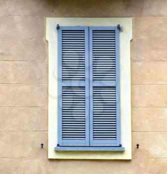 grey window   jerago    palaces italy   abstract  sunny day    wood venetian blind in the concrete  brick  
