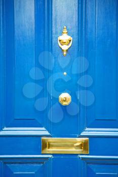  blue handle  in london antique  door  rusty  brass nail and light