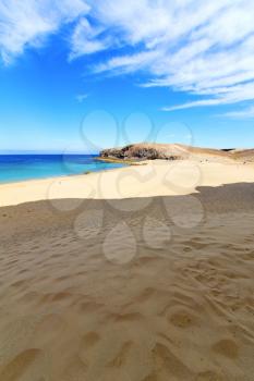white coast lanzarote  in spain   beach  stone water  and summer 