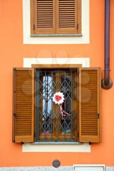   cavaria varese italy abstract  window      wood venetian blind in the concrete orange