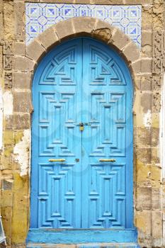 antique door in morocco africa blue wood and metal rusty