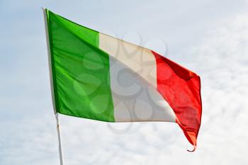 waving flag in the blue sky italy   colour and wave