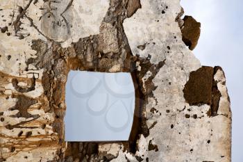 brown distorted door window in a broke paint wall arrecife lanzarote spain
