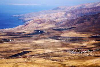 lanzarote view from the top in  spain africa and house field coastline
