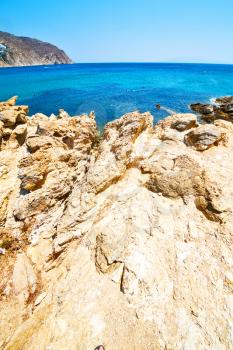 in      greece the mykonos island rock sea and beach    sky