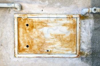
abstract  steel  padock zip in a   closed rusty metal pattern door   varese italy sumirago