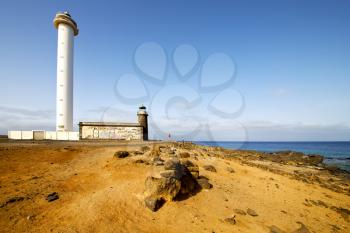 atlantic ocean lanzarote lighthouse and rock in the blue sky   arrecife teguise spain
