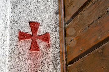 cross sumirago lombardy italy  varese abstract   wall of a curch broke brike pattern sunny day 