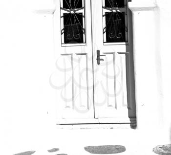   door      in antique village santorini greece europe   and white wall