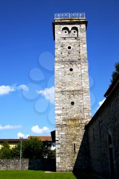  italy  lombardy     in  the arsago seprio    old   church   closed brick tower  wall grass