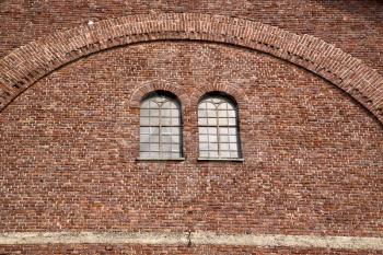  italy  lombardy     in  the  cardano campo    old   church   closed brick tower   wall rose   window tile   