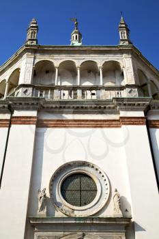  italy  lombardy     in  the  busto arsizio     old   church   closed brick tower   wall rose   window tile   abstract