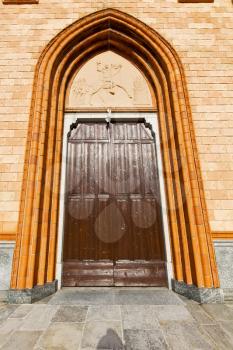 villa cortese italy   church  varese  the old door entrance and mosaic sunny daY rose window
