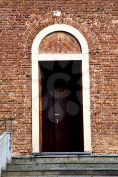  italy  lombardy     in  the cardano al campo old   church  closed brick tower     wall