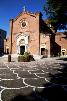 lombardy    in  the castellanza   old   church  closed brick tower sidewalk italy 
