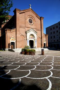 lombardy    in  the castellanza   old   church  closed brick tower sidewalk italy 
