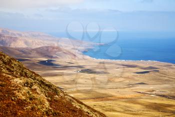 coastline lanzarote view from the top in  spain africa and house field 
