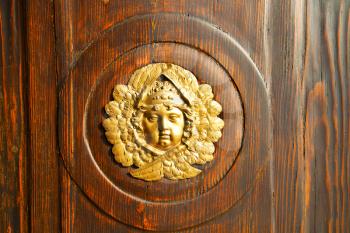 gold face  abstract  house door    in italy   lombardy   column  the milano old         closed nail rusty