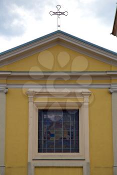 cavaria cross church varese italy the old rose window   and mosaic wall in the sky cloudy day