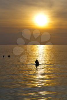 kho phangan sunrise people boat  and water in thailand  bay coastline south china sea