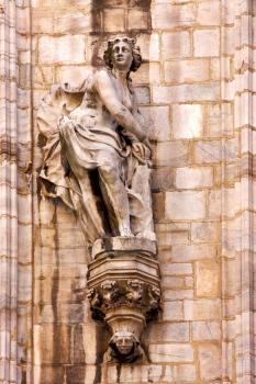 in milan italy statue of a women in the front of the duomo  church  and incision
