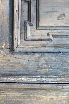 in  italy  patch lombardy    cross milan blur   abstract   rusty brass brown knocker  a  door curch  closed wood
