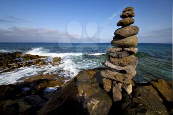 in lanzarote coastline  froth  spain pond  rock stone sky cloud beach  water  musk  and summer    
