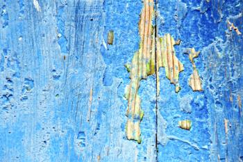 stripped paint in the blue wood door and rusty nail