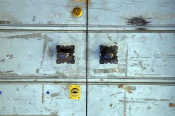 villadosia varese   abstract   rusty brass brown knocker in a  door curch  closed wood lombardy italy  
