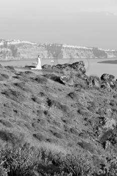 santorini    europe    greece and dry bush rock alone in the sky 