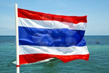 asia  kho phangan bay isle waving flag    in thailand and south china sea 