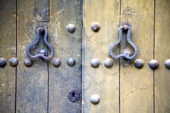 brown  morocco in africa the old wood  facade home and rusty safe padlock 