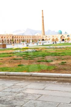 blur in iran   the old square of isfahan prople garden tree heritage tourism and mosque
