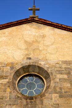  italy  lombardy     in  the barza     old   church   closed brick tower   wall rose   window tile   abstract